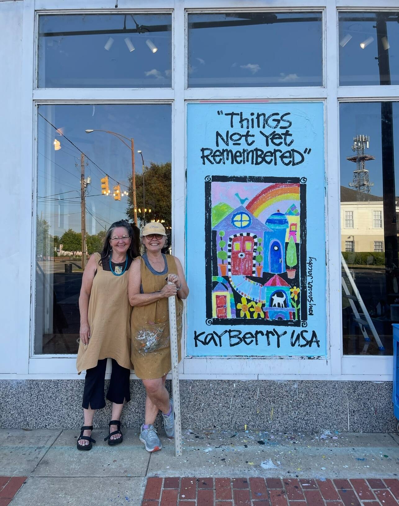 AC Reeves and Kay Jacoby in front of the final painting, "Things Not Yet Remembered"